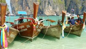 Lush Phi Phi coastline at dusk for a Phi Phi Tours banner by Legend Travel Group.